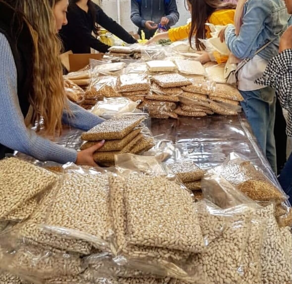 Volunteers packing food parcels for families